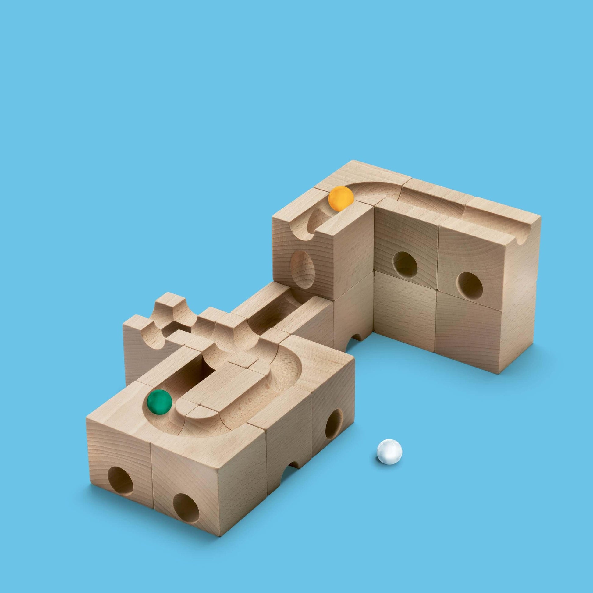 SPEED - Inject exhilarating velocity into your CUBORO marble runs with the SPEED Extra Set! This dynamic wooden educational toy includes 16 elements and 5 marbles, specifically designed to accelerate marbles, allowing them to cover longer distances with i
