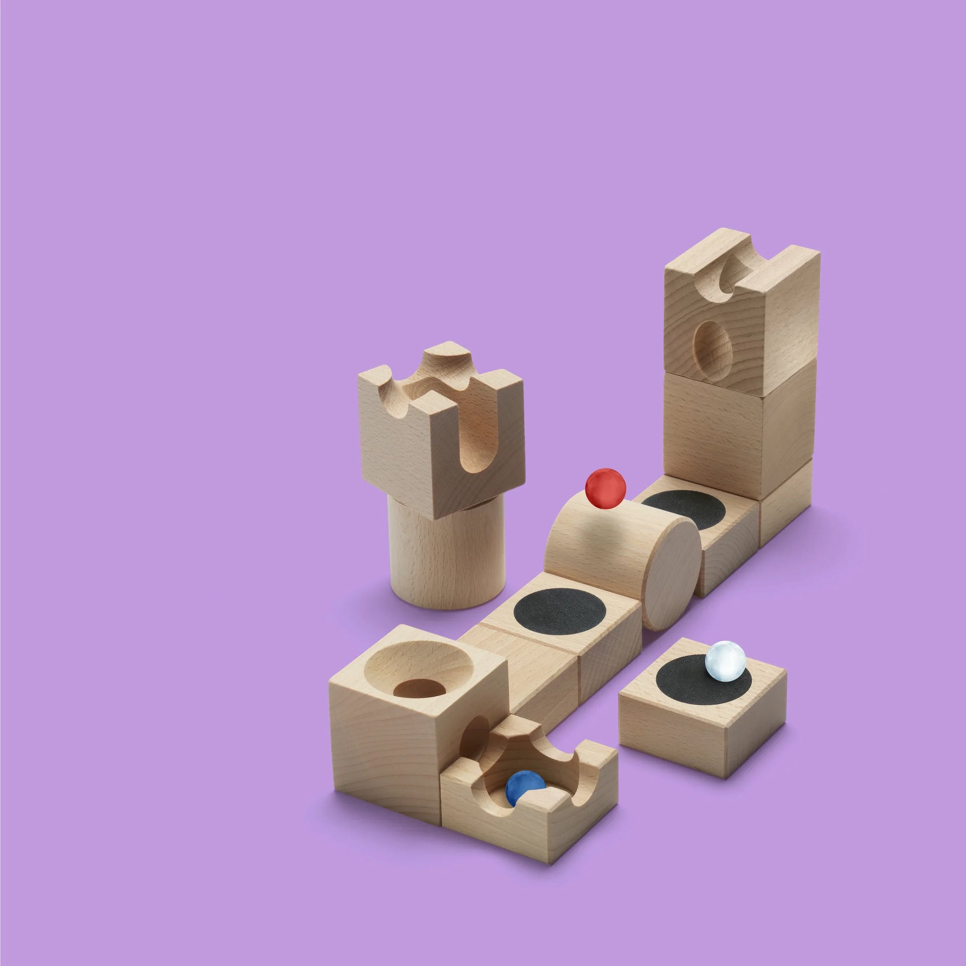 JUMP - Add thrilling leaps and daring jumps to your CUBORO marble runs with the JUMP Extra Set! This exciting wooden educational toy includes 12 elements and 3 marbles, featuring unique trampoline-like pieces that allow marbles to jump over obstacles and