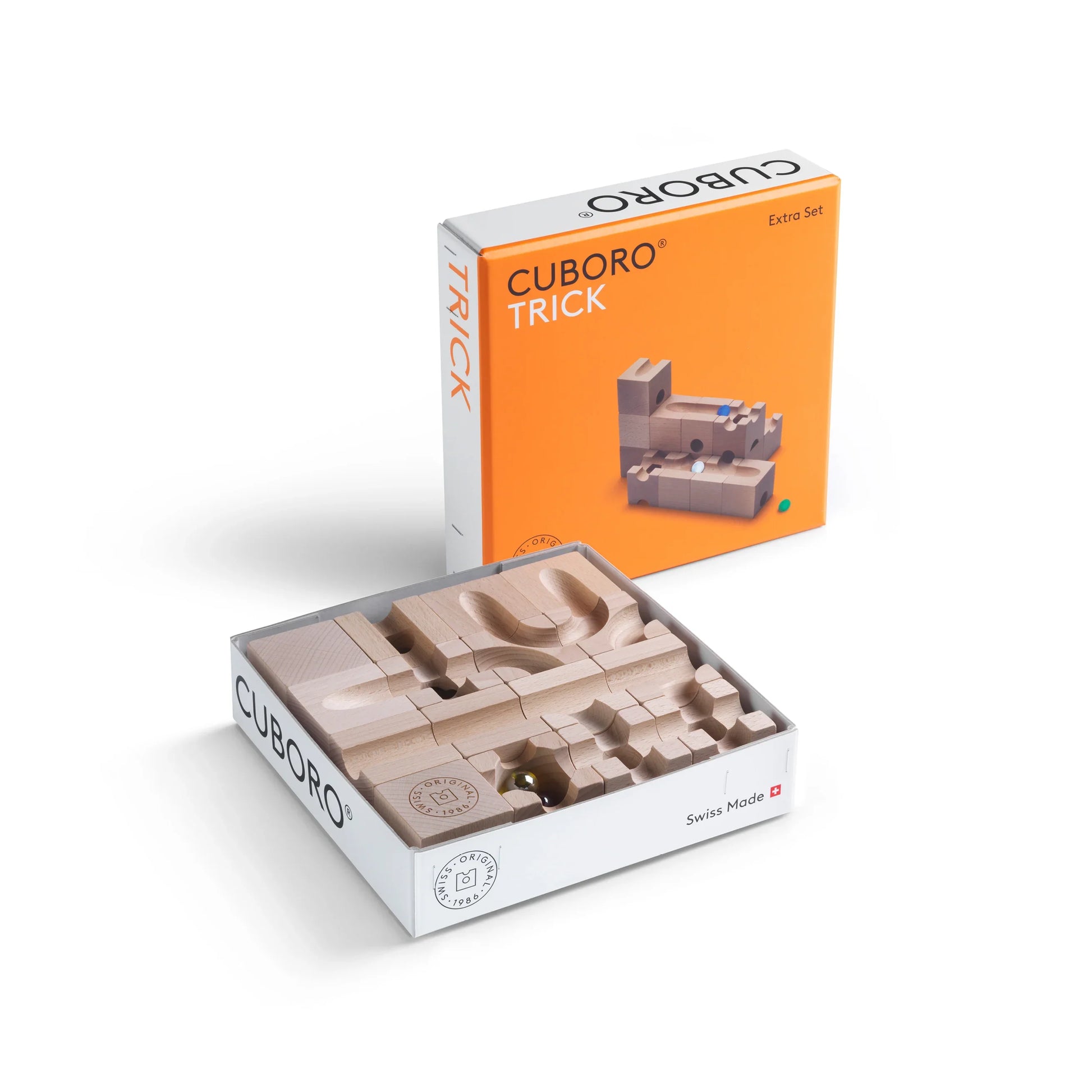 TRICK - Introduce an element of delightful unpredictability to your CUBORO marble runs with the TRICK Extra Set! This captivating wooden educational toy includes 16 elements and 5 marbles, designed to bring chance into play, causing marbles to take surpri